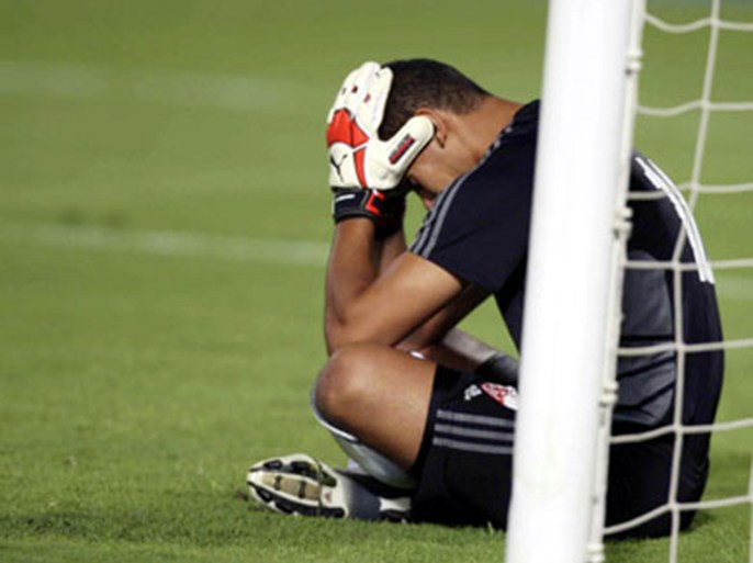 El Zamalek's goalkeeper Abdel Wahed Al Sayed reacts after Al-Ahly's second goal during their Egyptian Super Cup soccer match at Cairo stadium