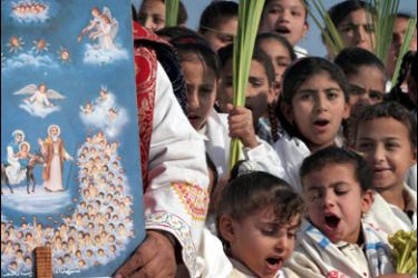epa00916459 Egyptian Christian girls sing next to a painting of angels holding the heads of children killed by King Herod in a Coptic Orthodox celebration of the Holy Family flight to Egypt which took place over two thousand years ago in the village of Deir Abu Hinnis,
