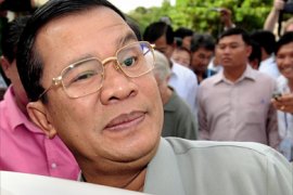 This photo taken on July 27, 2008 shows Cambodian Prime Minister Hun Sen smiling as he leaves a polling station in the Phnom Penh suburb of Ta Khmao after casting his vote.