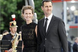 AFP / Syrian President Bashar al-Assad and his wife Asma al-Assad arrive for a diner at the Petit Palais, after attending Paris' Union for the Mediterranean founding summit, on July
