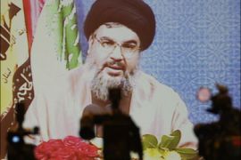 afp : Hezbollah's Secretary General Hassan Nasrallah is seen on a big screen in Beirut druing a press conference via video link at a secret venue on July 2, 2008. Nasrallah said
