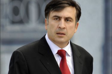 r : Georgia's President Mikheil Saakashvili arrives for a news conference in Tbilisi, August 11, 2008. Saakashvili said Moscow was trying to overthrow his government as Russian
