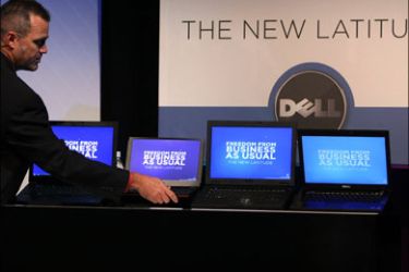 afp : Jeff Clarke, Dell Senior Vice President and General Manager of Dell Business Product Group, shows the new line of Dell Latitude laptops during a Dell product launch