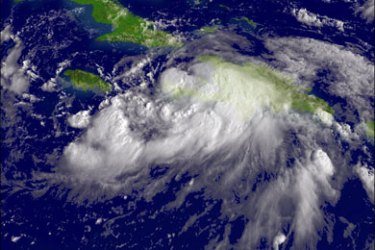 afp : In this satellite image provided by the National Oceanic and Atmospheric Administration (NOAA), Tropical Storm Gustav moves northwest over the island of Haiti at 13:15