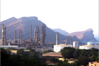 epa00565450 A petroleum refinery is located along Oman's dramatic coast in the capital of Muscat, 26 October 2005. Petroleum accounts for 40 per cent of Oman's Gross