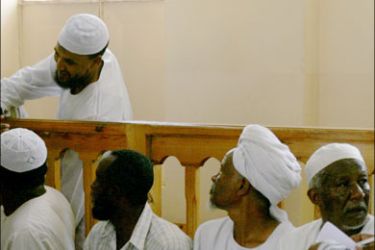 afp : Sudanese Islamists accused of killing a US diplomat and his driver attend their trial in the Sudanese capital Khartoum on August 31, 2008. The five Islamists, in shackles