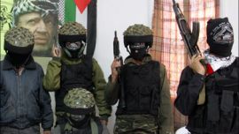 afp : Palestinian members of Al-Aqsa Martyrs Brigades, an armed wing loosely linked to Palestinian president Mahmud Abbas's Fatah movement, hold a press conference under a