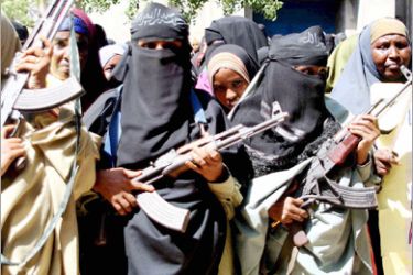 epa00880713 Veiled Somali women hold Kalashnikov guns during a demonstration held by the Islamic Courts Union (UIC) in the port town of Kismayo, in southern Somalia,