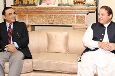 AFP / This hand out picture released by Pakistan People's Party shows Pakistani former premier Nawaz Sharif talks with coalition partner Asif Ali Zardari during a meeting in