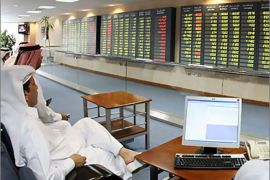 . AFP - Investors follow the stock market activity on monitors at the Doha Securities Market in Doha on September 16, 2008. Global equities tumbled for a second day running today as