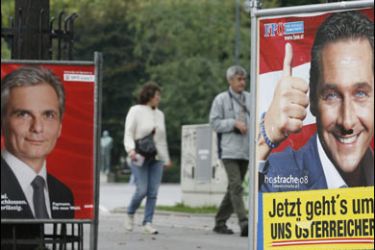 F/Election posters are seen in Vienna' first district showing the Leader of the far-right fredom party (FPOe) Heinz-Christian Strache (R) and Austrian Social-democrate (SPOe) chairman Minister for infrastructure Werner Faymann (L) on September 27, 2008 ahead of September 28 general election in Austria.