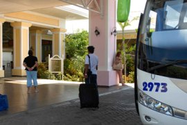 Tourists wait to leave a hotel in a bus in Varadero beach, Matanzas province, 130 km east of Havana, on the impending arrival of Hurricane Ike,