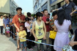 Parents accompanying their children for a check-up queue up in front of Longgang central hospital in Shenzhen, in southern China's Guangdong province
