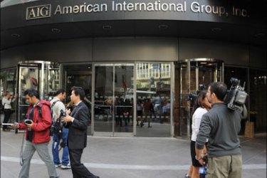 afp : Media gather outside the offices of of troubled insurer American International Group Inc. September 17, 2008 in the lower Manhattan area of New York. The US Federal Reserve
