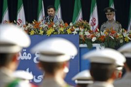 Iranian soldiers march past President Mahmoud Ahmadinejad (back-C) during a military parade in Tehran on September 21, 2008