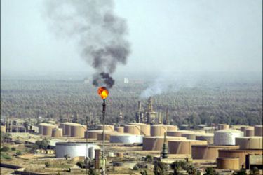 afp : (FILES) In an aerial file picture taken on July 4, 2008, a trail of smoke rises from the flame of the Al-Dora oil refinery complex in Baghdad. Iraq on September 2, 2008 cleared a