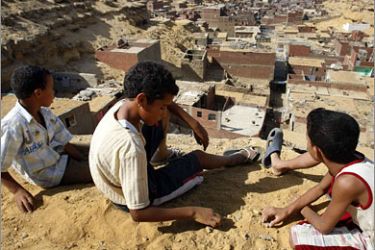 REUTERS/Children play in Manshiyet Nasser shanty town in eastern Cairo September