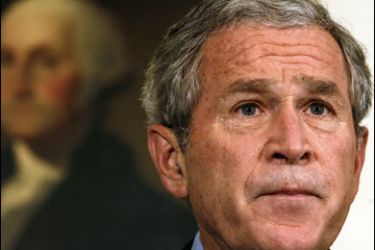 r/Standing in front of a painting of George Washington, U.S. President George W. Bush speaks about the economic rescue plan at the White House in Washington September 30, 2008.