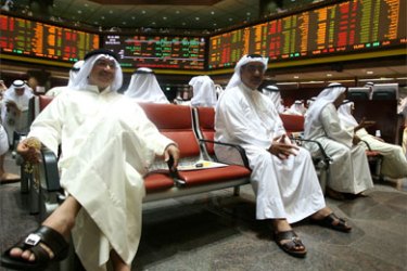 Kuwaiti traders follow the market's movement at the Stock Exchange in Kuwait City on October 9, 2008.