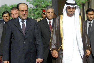 afp : Emirati Crown Prince Sheikh Mohammed bin Zayed al-Nahayan (R) is welcomed on October 07, 2008 by Iraq's Prime Minister Nuri al-Maliki(L) upon his arrival at Baghdad