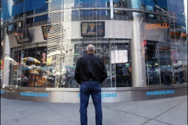 r/A man stands outside the NASDAQ Market Site as the televised speech by U.S. President George W. Bush is broadcasted on in New York October 10, 2008.