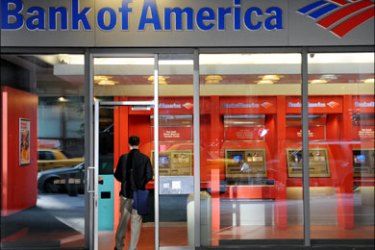 afp : (FILES)A man walks into a branch of Bank of America September 17, 2008 in the lower Manhattan area of New York. Bank of American said October 6, 2008 it was ready to