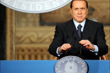 afp ; Italian Prime Minister Silvio Berlusconi gives a press conference following a cabinet meeting on October 10, 2008 in Naples. Berlusconi convened his cabinet meeting to