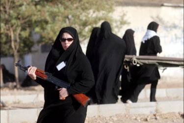 afp : Iranian women from the Islamic republic's Basij militia take part in armed manouevres at a Revolutionary Guards base outside Tehran on October 8, 2008. The exercises for