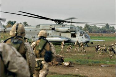 f/(FILES) A handout file picture released on November 23, 2004 by the US Marines, shows Marines from Company Suicide Charlie, 1st Battalion, 7th Marine Regiment, Regimental Combat Team 7, being picked up by a helicopter after conducting a cordon and knock in Al-Qaim, on the Syria border in western Iraq. American helicopter-borne troops launched an assault on October 26, 2008
