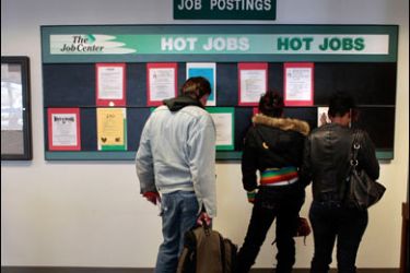 f/DAYTON, OH - OCTOBER 30: Unemployed people look over a job listing board at The Montgomery County Job Center October 30, 2008 in Dayton, Ohio.