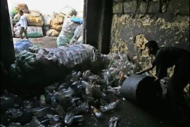 f/An Egyptian worker collects plastic bottles at the poor area of al-Zabbalin in Cairo on October 20, 2008 where Franco-Belgian Sister Emmanuelle spent 20 years helping some of the world's poorest people