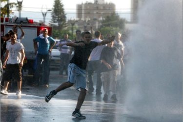AFP Israeli riot police spray young Israeli protesters with water during clashes in Acre on October 10, 2008. Police clashed with Jewish protesters in Acre today