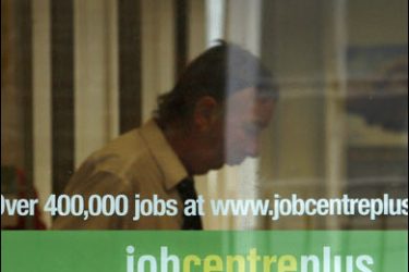 r/A man is seen behind the window of a job centre in central London October 15, 2008