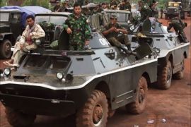 Cambodian soldiers sit on an armored vehicle at Sraem village in Preah Vihear province, 543 km (337 miles) north of Phnom Penh, October 16, 2008. Thai and Cambodian troops