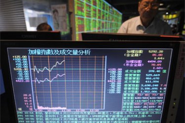 An investor looks at a monitor showing the stocks index figures in Yungho, Taipei county on October 9, 2008