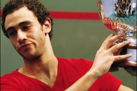 f/Ramy Ashour of Egypt celebrates beating compatriot Karim Darwish in the Men's final of the World Squash Championships at the National Squash Centre in Manchester, north west England on October 19, 2008.