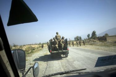 Soldiers of Pakistan's army patrol a road in Loisam town in the Bajur tribal region on October 25, 2008. Pakistani troops have recaptured a key town from Al-Qaeda and Taliban