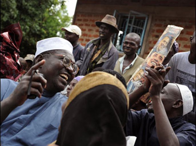 f/Malik Obama, half-brother of America's President elect Barack Obama, sings with members of his family November 05, 2008 at his Kogelo village residence where he gave a press conference following news that his brother had been