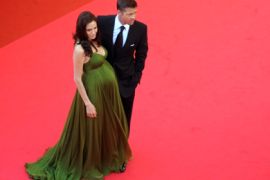 US actors Angelina Jolie (L) and Brad Pitt pose as they arrive to attend the screening of US directors John Stevenson and Mark Osborne's animated film 'Kung Fu Panda' at the 61st