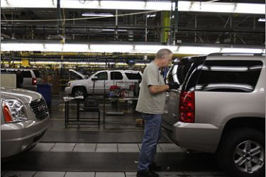 REUTERS/A General Motors employee works the assembly line at the GM assembly plant in Arlington, Texas