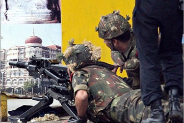 AFP / Indian army soldiers prepare to use a grenade launcher against gunmen hiding inside the Taj Mahal hotel in Mumbai on November 28, 2008. The Indian military launched a