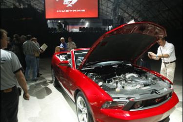 r/A car enthusiast takes a picture of Ford's 2010 Mustang at an unveiling in Santa Monica, California November 18, 2008.