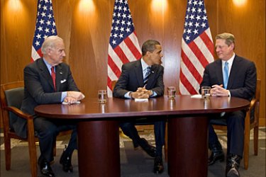 f_US president-elect Barack Obama (C) former vice president Al Gore (R) speaks with as vice president-elect Joe Biden after a meeting at the Transition Office in Chicago on
