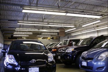 r : Automobiles sit in a garage at a Toyota dealership in Chicago, December 22, 2008. Toyota Motor Corp forecast a first-ever annual operating loss, blaming a relentless sales