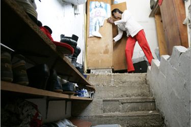 REUTERS/ A foreign domestic worker is seen at a shelter run by a non-profit organization "Caritas" in Dora, east of beirut in this December 3, 2008 photo. The Shelter hosts migrant women