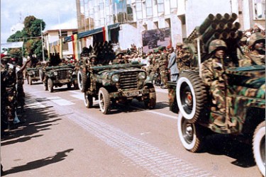 AFP (FILES) A picture taken on October 2, 2008 shows armoured vehicles fitted with rocket launchers of the Guinean army parading on the big avenue leading to the Presidential Palace