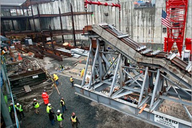 /AFP - The World Trade Center "Survivors Stairs" is moved to its final location at the Memorial Museum site located at ground zero December 11, 2008 in New York City. The stairs are the sole remaining