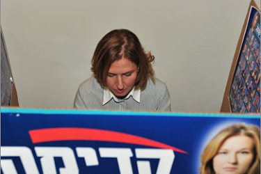 AFPTzipi Livni, Israeli Foreign Minister and head of the Kadima party, casts her ballot in an internal party vote to determine the list of candidates for the February 10