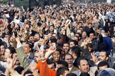 r : People protest during a demonstration against the Israeli air strikes on Gaza, in front the lawyers syndicate in downtown Cairo December 31, 2008. Thousands of