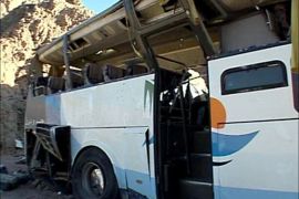 r_A video grab shows the wreckage of a bus sits by the side of the road after it overturned between two Egyptian resorts in the Sinai peninsula December 22, 2008
